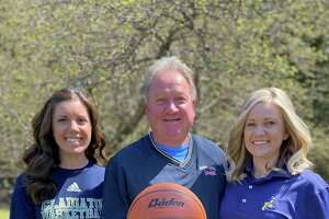 Manistee Catholic Central coach Todd Erickson and his daughters, Kelly (left) and Katie (right), are all involved in girls basketball varsity programs. (Courtesy photo)
