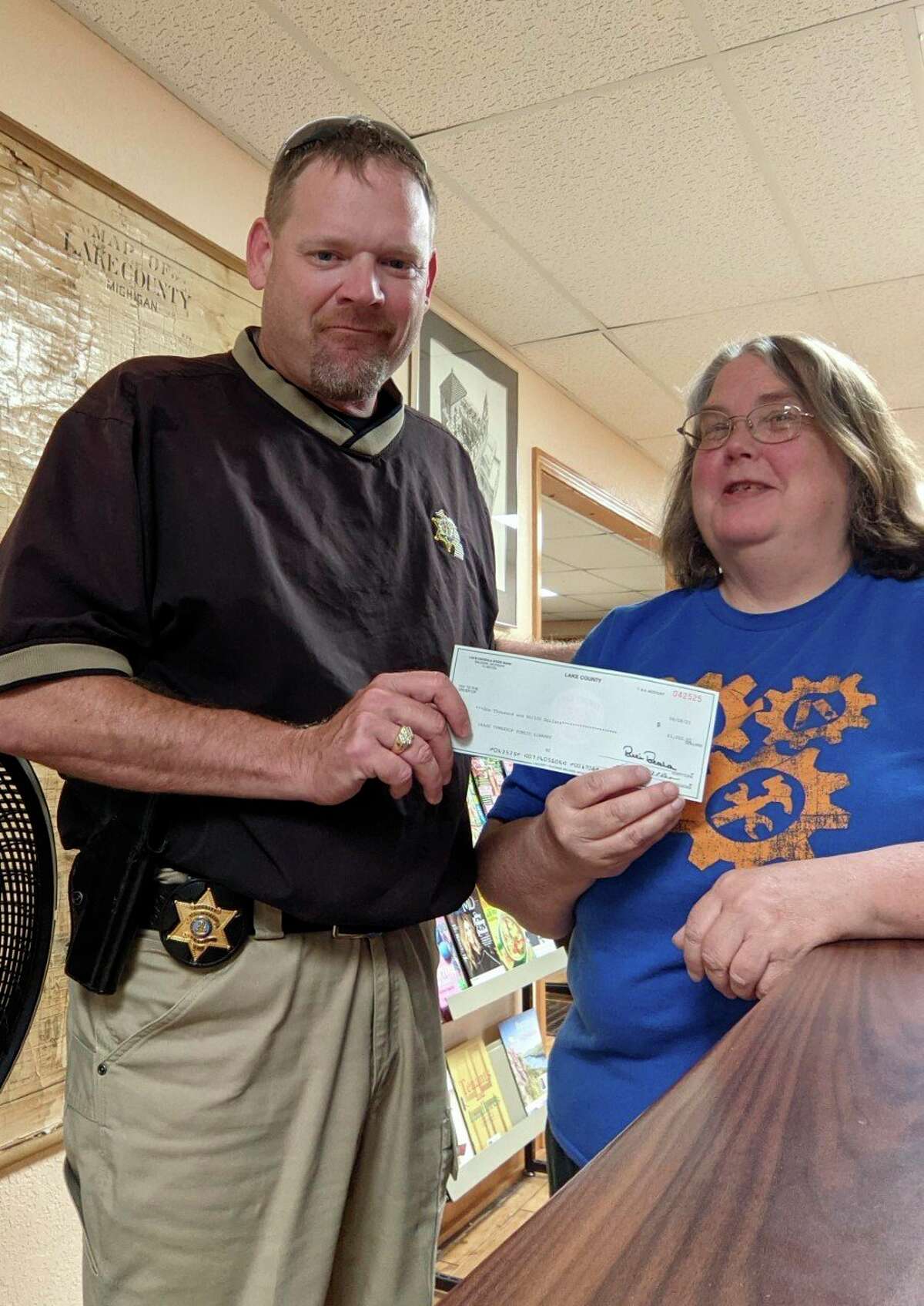 Lake County Sheriff Rich Martin presented Chase Public Library with a donation of $1000 this week as part of the Sheriff's Charitable Campaign. (Submitted photo)
