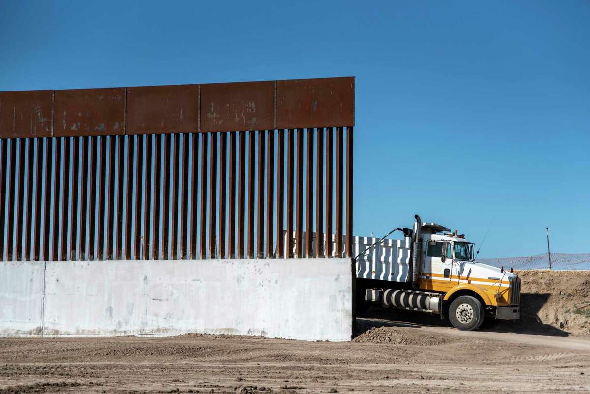 A dump truck moves along a selection of completed border wall near McAllen, Texas on Oct. 29, 2020. Laredo City Council announced Monday night that it plans to send a letter of opposition to Gov. Greg Abbott on his plans for a border wall paid by the state and through crowdfunding.