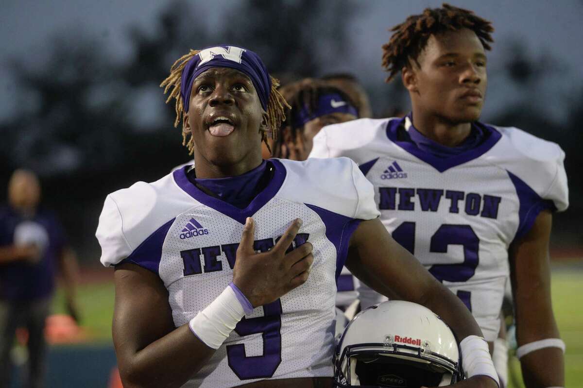 Newton's Deanthony Gatson and teammates observe the anthem before facing West Orange - Stark during their match-up Friday night in West Orange. Photo taken Friday, September 18, 2020 Kim Brent/The Enterprise