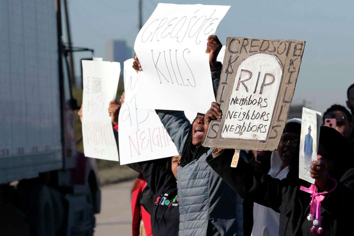 Protestors wave signs at passing trucks as they demonstrate roadside against Union Pacific at the rail yard affected by the creosote contamination in the 7500 block of Liberty Road Friday, Feb. 14, 2020 about five miles east of downtown in Houston, Texas.