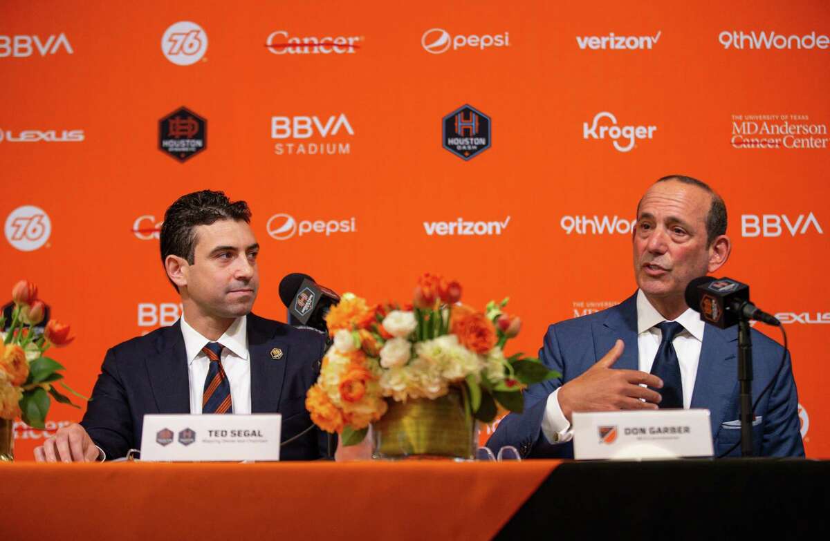 MLS commissioner Don Garber, right, answers question from a reporter during the press conference in which Ted Segal, left, was announced as the majority owner of the Houston Dynamo FC and Dash Houston, at BBVA Stadium on Tuesday, June 22, 2021, in Houston.