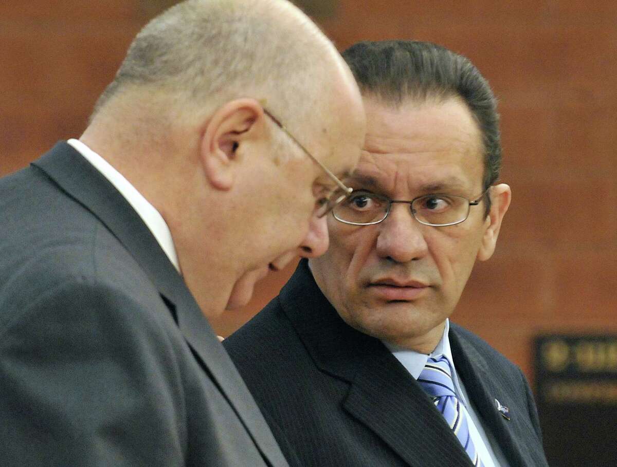 Hartford Mayor Eddie Perez, right, looks to his attorney Hubert Santos during his arraignment in Superior Court in Hartford, Tuesday, Feb. 3, 2009. Perez is charged with receiving a bribe, fabricating physical evidence, and conspiracy to fabricate physical evidence. (AP Photo/Jessica Hill, Pool)