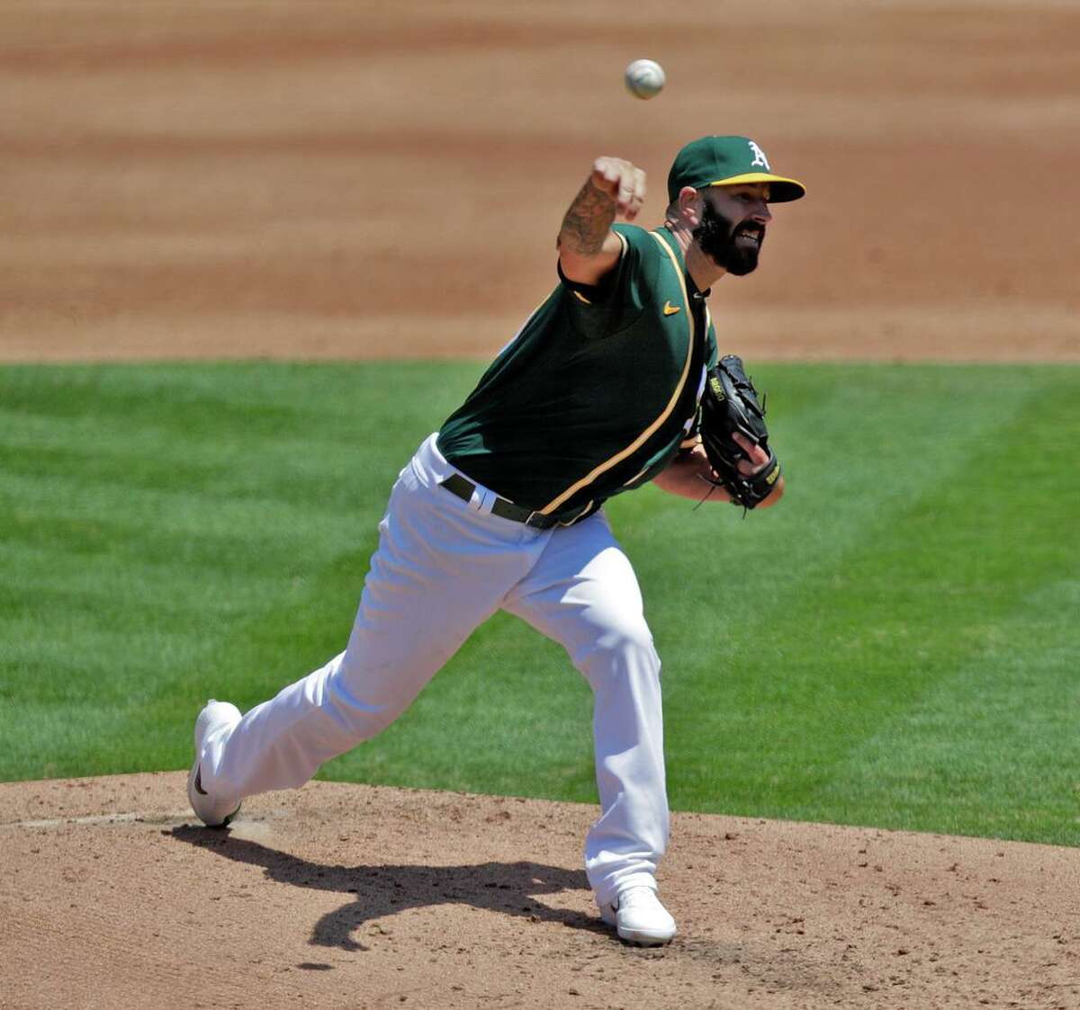 A's starter Mike Fiers (50) pitches in the first inning as the Oakland Athletics played the Los Angeles Angels of Anaheim at the Coliseum in Oakland, Calif., on Sunday, July 26, 2020.