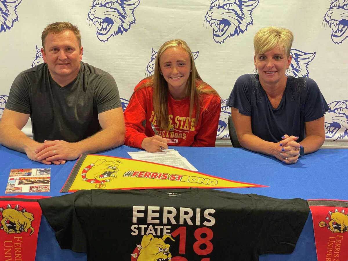 Mackenzi VanBuren (center) signed a letter of intent to run track and field at Ferris recently. He was joined by her parents, Brad and Michelle. (Courtesy photo)