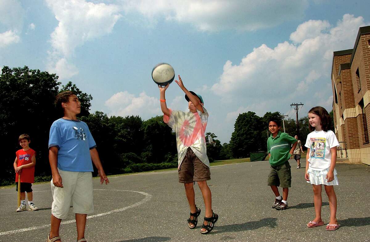 Val 8/11/05 volpe 0214: Children shoot hoops during the Shelton Parks and Recreation summer playground program.