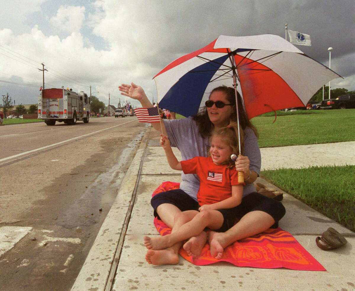The Fourth of July parade is a longtime tradition in La Porte. Here, Gaylynn Lassetter and daughter Grace wave at the procession in 2003. This year’s event will be held on July 2 along with a trade day and a fireworks display from Sylvan Beach Park.