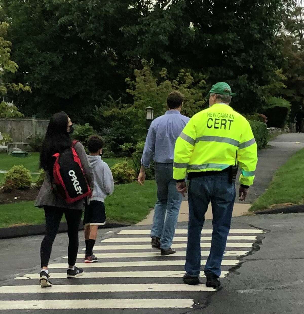 New Canaan CERT Team member volunteer Kevin McIntosh escorts students across the street at this year’s “Walk to School Event.” Continuing via virtual training this year, New Canaan’s CERT is planning virtual, (online,) basic training classes, this summer, on Wednesdays, along with also Thursdays, on select dates.