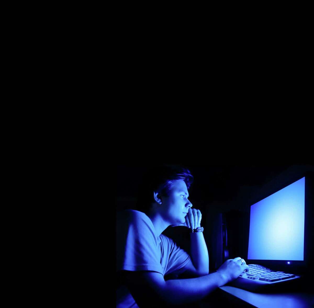 Guy looking at computer screen(Dreamstime/TNS)