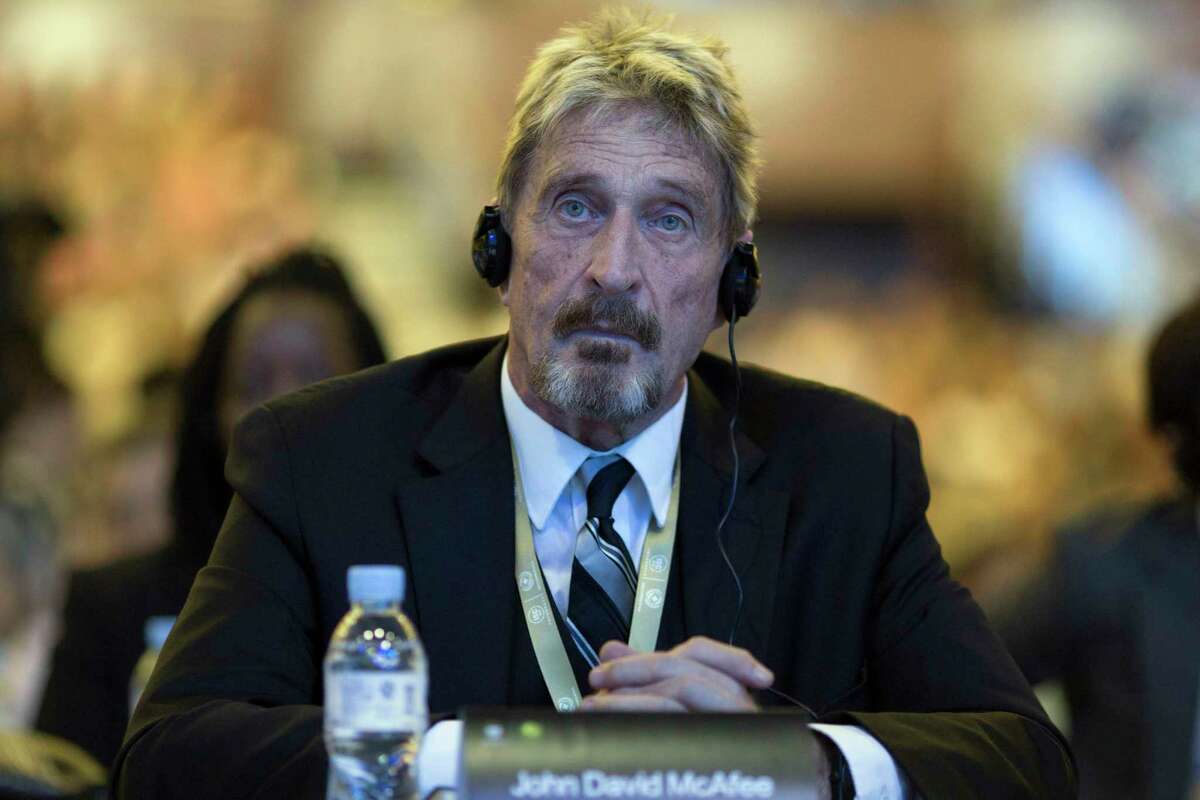 FILE - In this Tuesday, Aug. 16, 2016 file photo, founder of the first commercial anti-virus program that bore his name, John McAfee listens during the 4th China Internet Security Conference (ISC) in Beijing. Spain's National Court has approved the extradition of detained antivirus software entrepreneur John McAfee to the United States, where he is wanted on tax-related criminal charges that carry a prison sentence of up to 30 years.