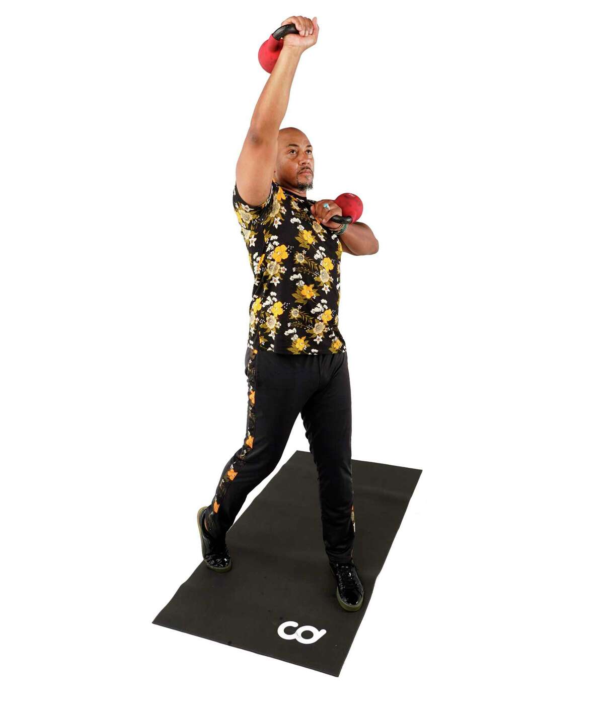 Rotate your torso 90 degrees while pressing the kettlebell overhead. Pivot the ball of your trail foot and return to rack position.
