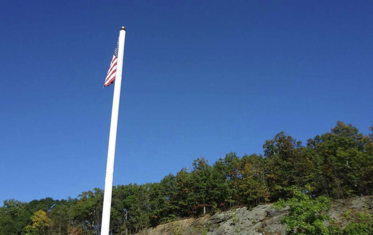 A monopole cell tower, much like another of the town's monopoles shown above, is being discussed for School Road.