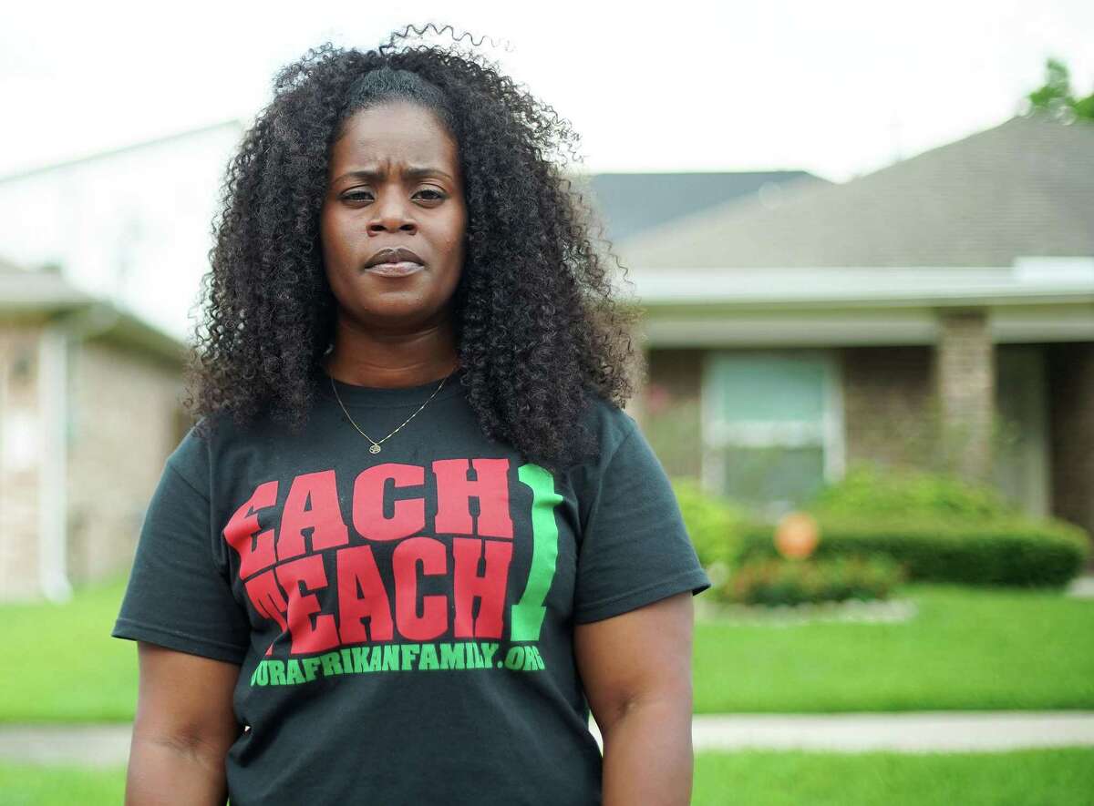 Kendra London stands on the street she grew up in Houston's Fifth Ward neighborhood on Tuesday, June 22, 2021. London, an affordable housing advocate, wants housing to be affordable for people who grew up in the neighborhoods and want to stay.