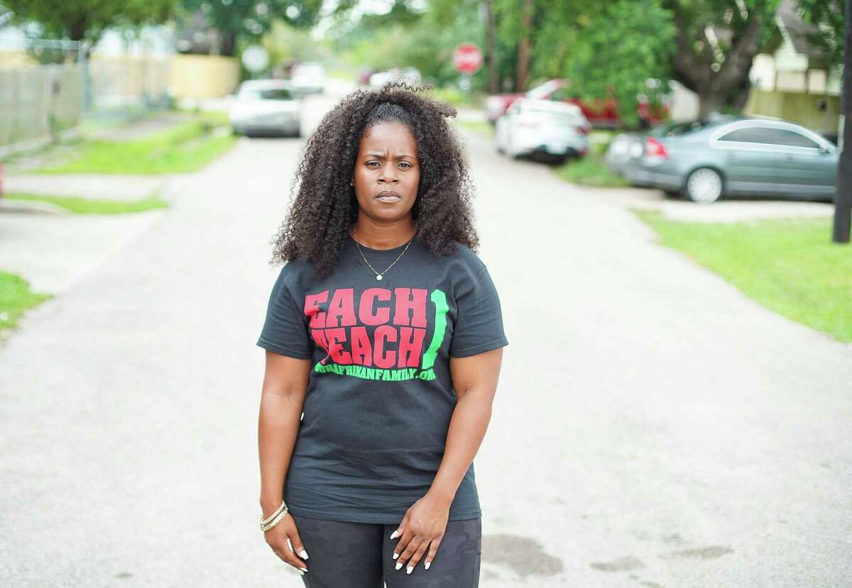 Kendra London stands on the street she grew up in Houston's Fifth Ward neighborhood on Tuesday, June 22, 2021. London, an affordable housing advocate, wants housing to be affordable for people who grew up in the neighborhoods and want to stay.