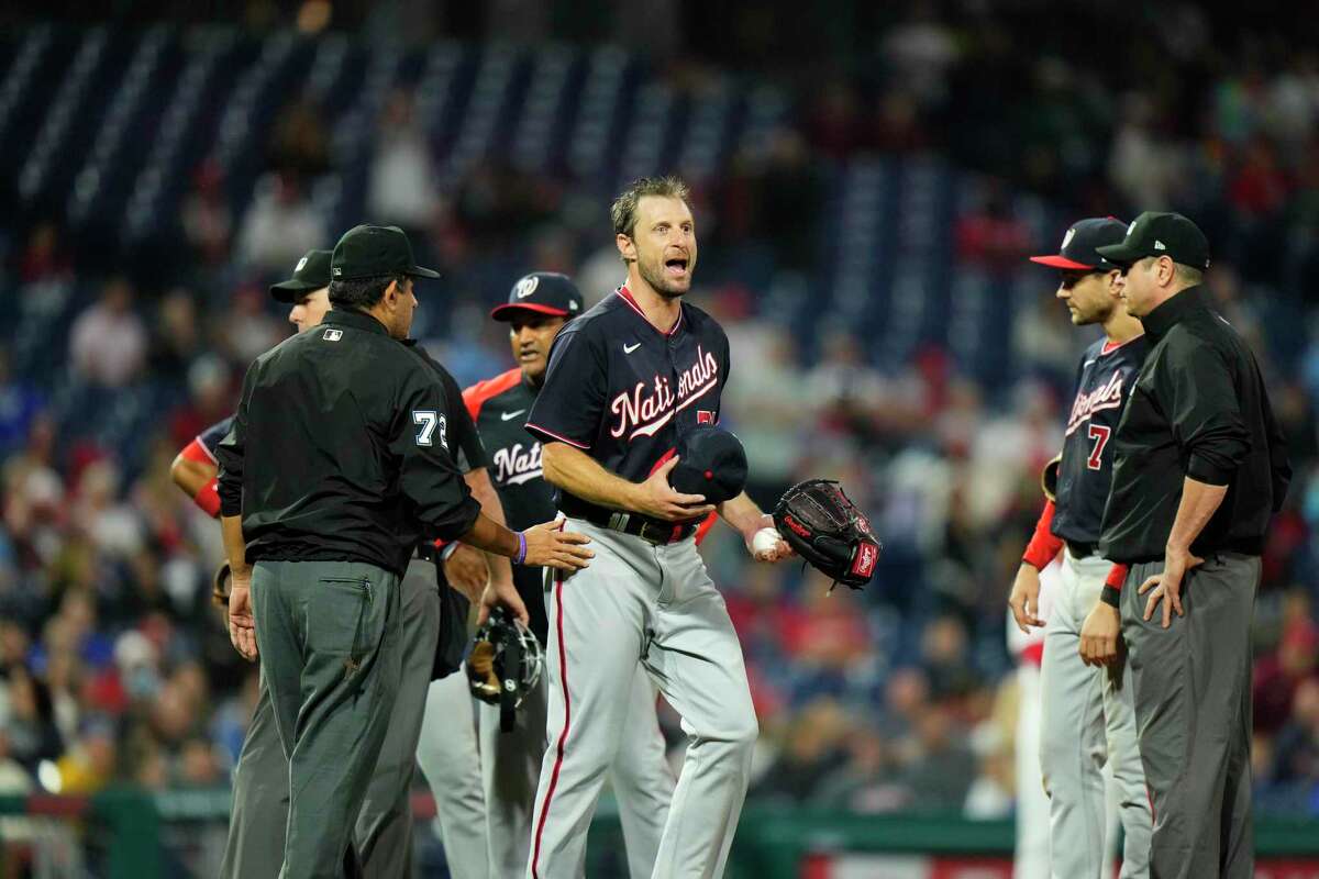 Washington Nationals' Max Scherzer reacts as he is being checked for foreign substances during a baseball game against the Philadelphia Phillies, Tuesday, June 22, 2021, in Philadelphia. (AP Photo/Matt Slocum)