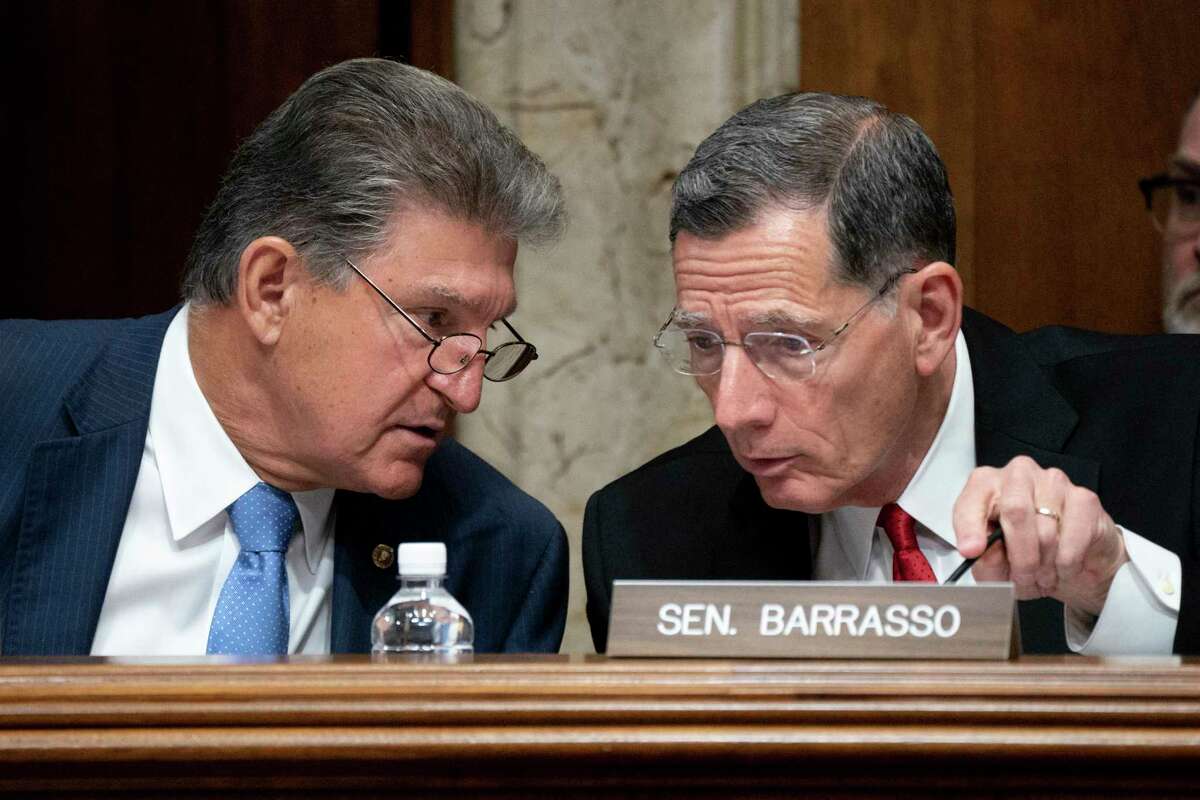 Sen. Joe Manchin, D-W.Va., chairs a Senate Energy and Natural Resources Committee hearing with Ranking Member Sen. John Barrasso, R-Wyo., right, on infrastructure needs of the U.S. energy sector, western water and public lands, at the Capitol in Washington, Wednesday, June 23, 2021. Manchin and other Senate infrastructure negotiators are meeting with President Joe Biden at the White House later today.
