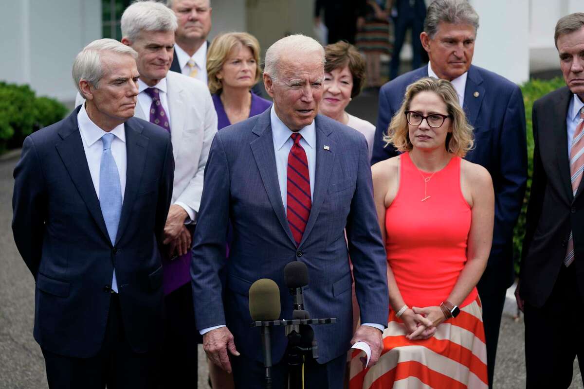 President Joe Biden, with a bipartisan group of Senators, speaks Thursday June 24, 2021, outside the White House in Washington. Biden invited members of the group of 21 Republican and Democratic senators to discuss the infrastructure plan.
