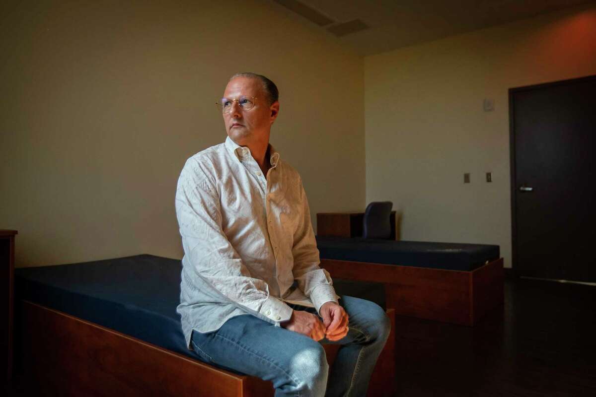 Kevin Munz, chairman of the board of governors for Sacred Oak Medical Center sits in a vacant room inside the Clear Lake mental health facility he and his wife, Sandra, opened in 2017. The hospital was recently shut down by the state for failing to achieve “sustained compliance” with state and federal rules and regulations.