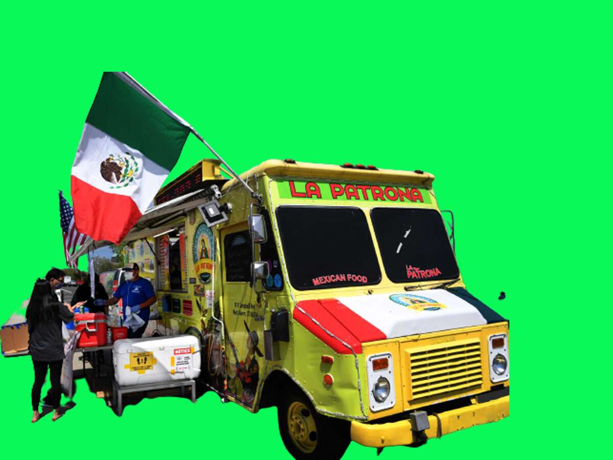 Customers shop at newly-reopened food trucks at Long Wharf in New Haven, Conn. on Tuesday, May 26, 2020. The trucks were forced to close when the coronavirus pandemic hit to address health department concerns including the use of masks and social distancing.