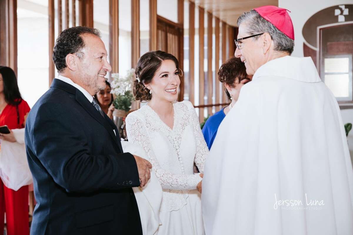 Mariana talking with Archbishop Gustavo Garcia-Siller.