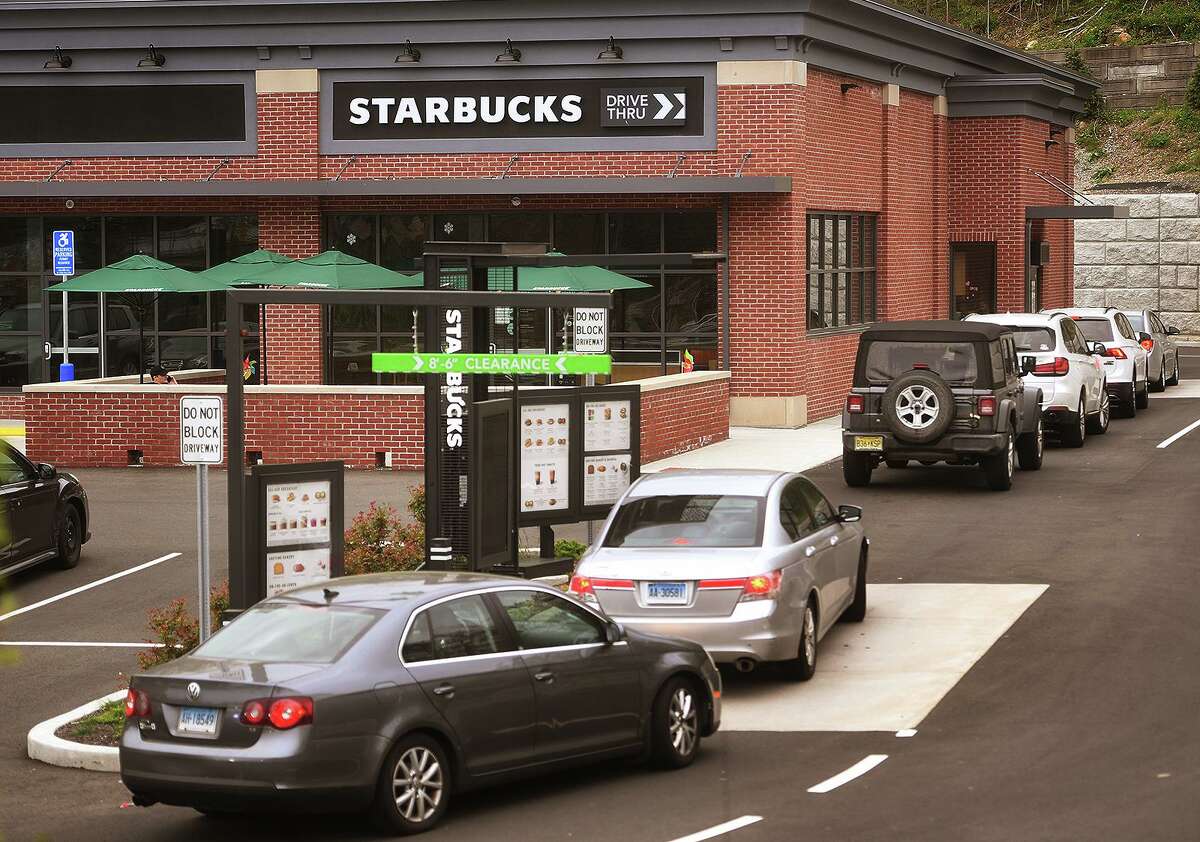 Cars are lined up at the new Starbucks Drive-Thru at 965 White Plains Road in Trumbull, Conn. on Monday, May 3, 2021.