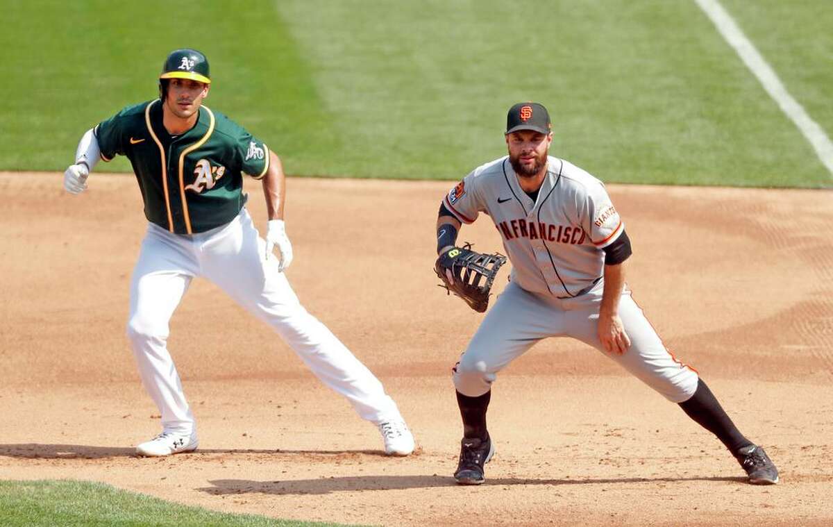 The A’s may trade Matt Olson (left) and Brandon Belt is a free agent, though the Giants have made him a qualifying offer.
