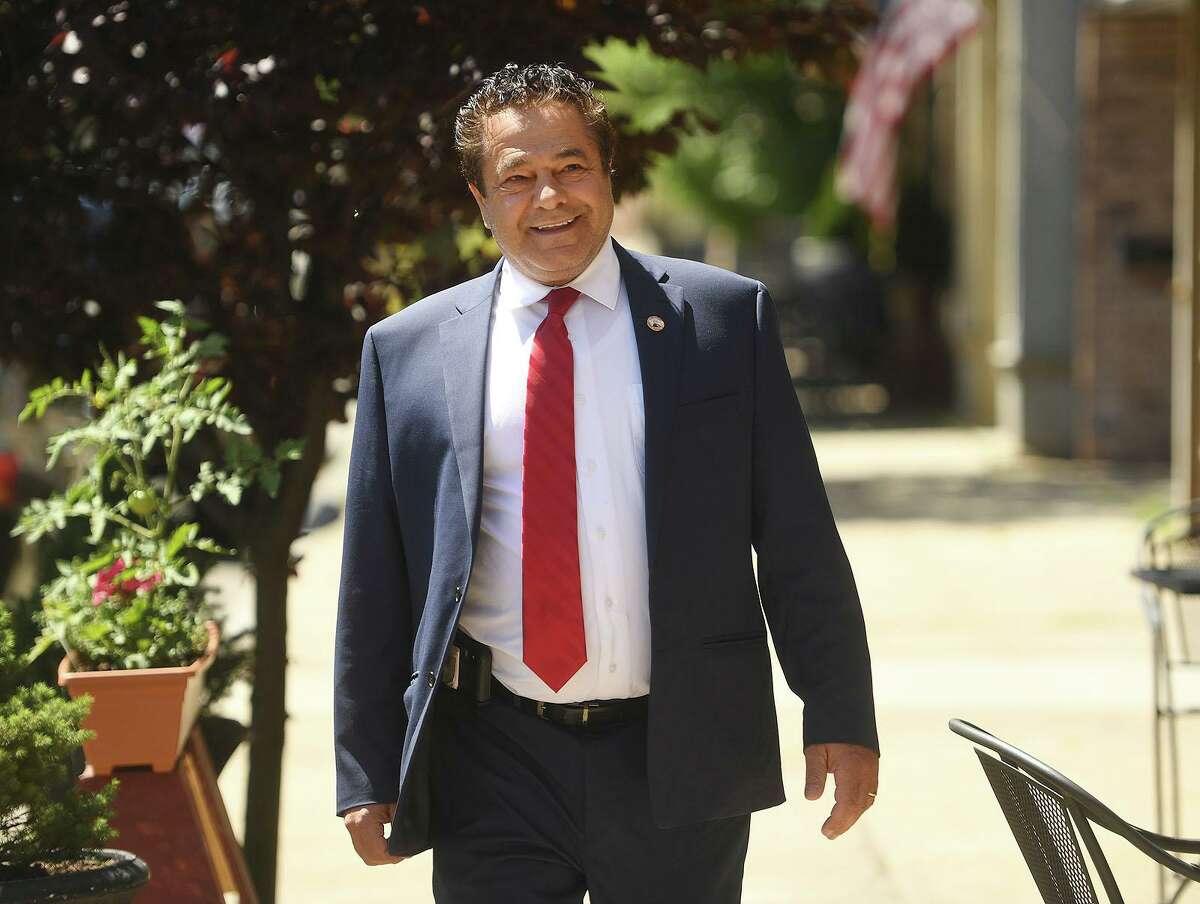 Ansonia Mayor David Cassetti smiles as he walks up Main Street to announce his plans to run for re-election in Ansonia, Conn. on Thursday, June 24, 2021.