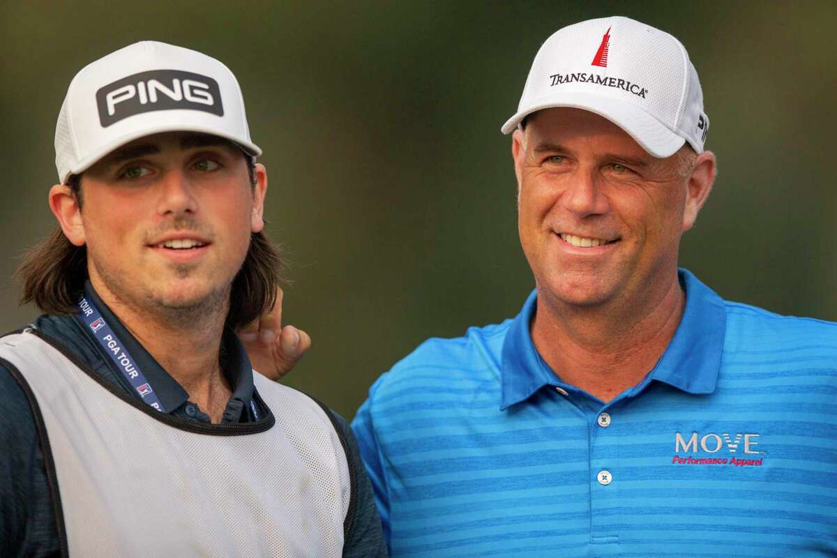 Stewart Cink, right, with his son and caddie Reagan after they won the Safeway Open in Napa, Calif., last September.