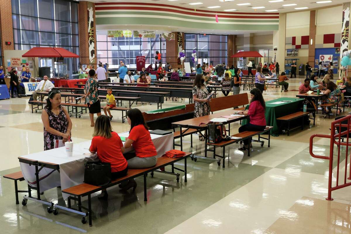People complete applications and interview for available positions at the Judson ISD Job Fair at Judson High School on Wednesday, June 23, 2021. Judson ISD was accepting applications and giving same-day interviews for teachers, teacher aides, substitutes, bus drivers, child nutrition, custodians, maintenance and Adventure Club aides.