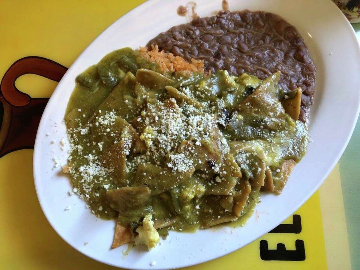 The chilaquiles verde at SanJalisco, doused in a glossy tomatillo salsa and scattered with gooey nopal and cheese.