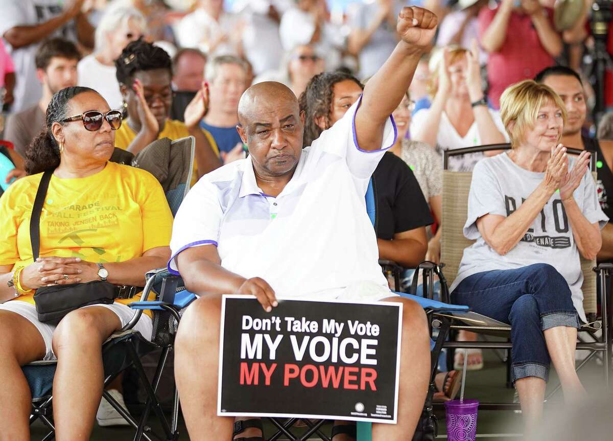Keith Downey of Kashmere Gardens holds up a fist in solidarity during a rally sponsored by Beto O'Rourke's Powered By People at Finnigan Park in Houston's Fifth Ward on Sunday, June 13, 2021. The tour was hitting multiple counties in Texas to drum up support for voting rights.