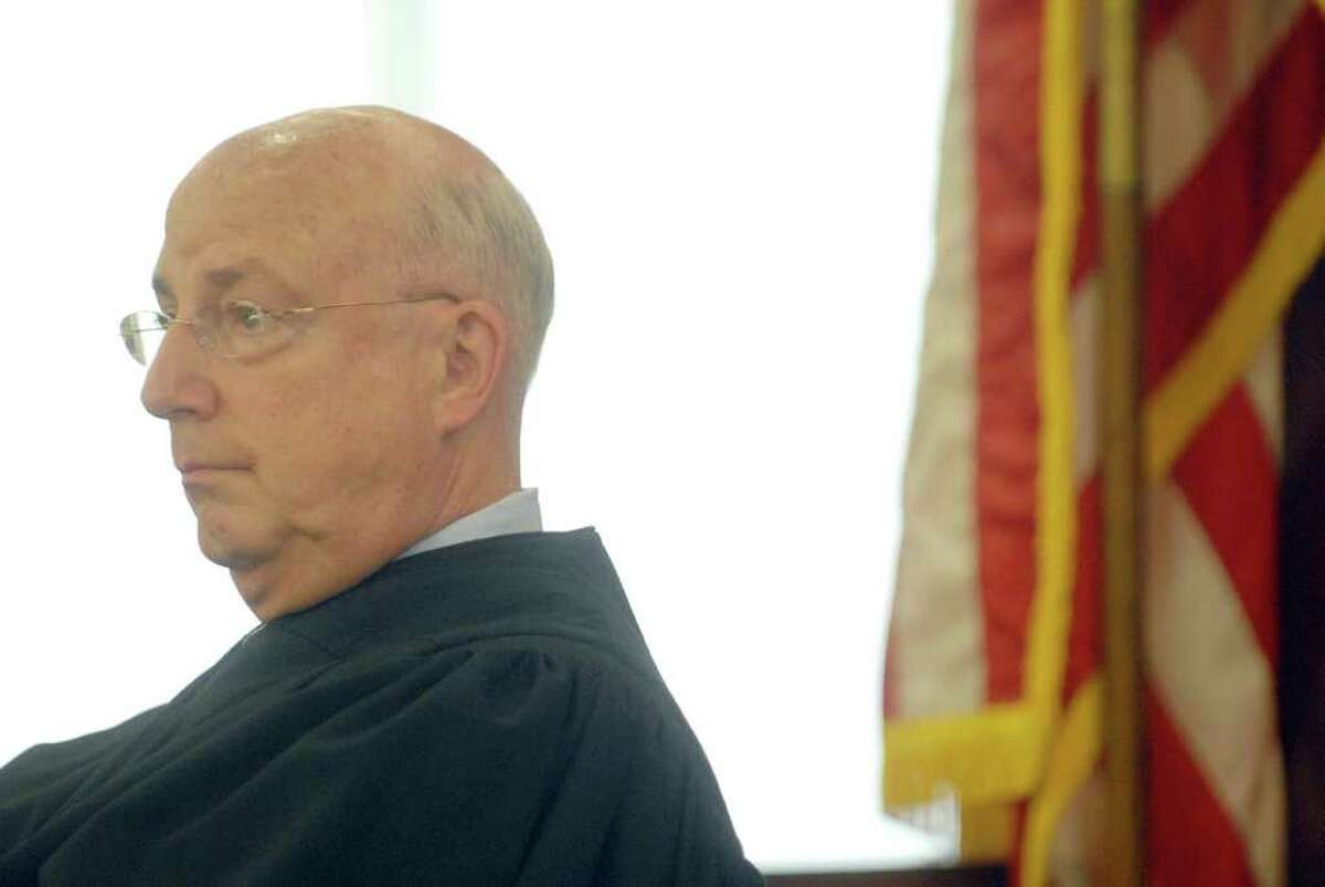 Judge Stephen W. Herrick listens to attorneys Tuesday during a hearing at the Albany County Judicial Center in the case of ballot fraud in Troy . During the hearing lawyers made arguments on the special prosecutor?s attempt to get a search warrant to collect DNA from a city councilman and the city clerk. (Paul Buckowski / Times Union)