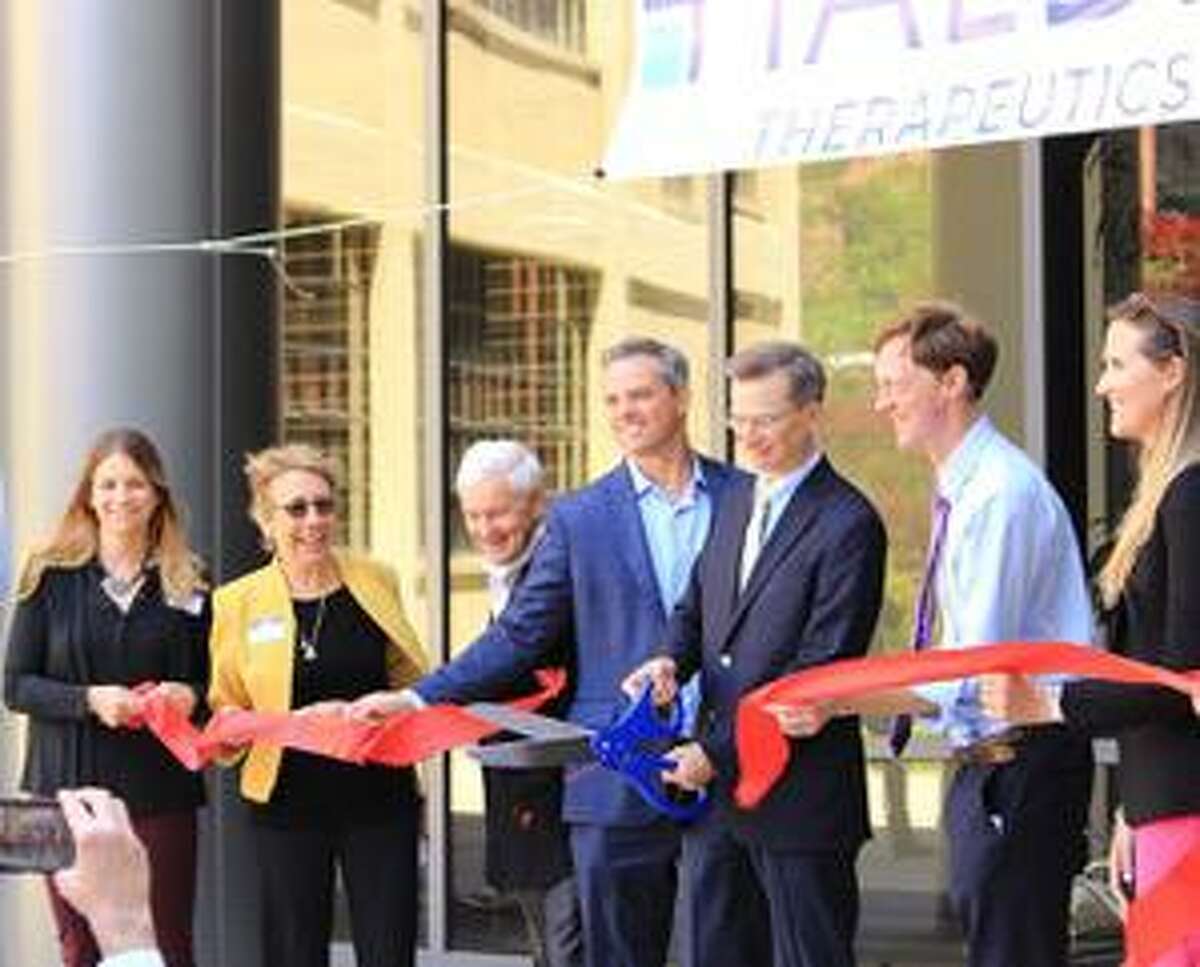 City officials and representatives of the New Haven business community do a ceremonial ribbon cutting at the grand opening of Halda Therapeutics on Wednesday. From left to right: e Katherine Kayser-Bricker, Halda's chief scientific officer ;  Dawn Hocevar, president and chief executive officer of BioCT; Alex Twining, chief executive officer of Twining Properties;  Garrett Sheehan, president of The Greater New Haven Chamber of Commerce; Craig Crews, Halda's founder; New Haven Mayor Justin Elicker, and Alexandra Daum, deputy commissioner of the Connecticut Department of Economic and Community Development.