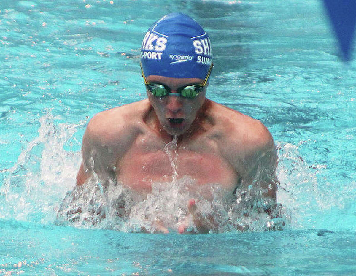 Victor Humphrey of Summers Port swims the breaststroke in the 15-18 boys medley relay Thursday against the Collinsville Gators at Summers Port in Godfrey.