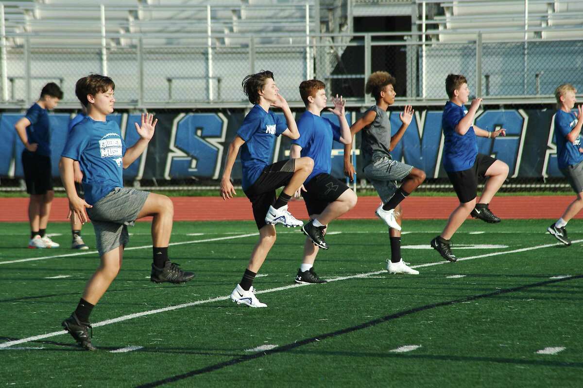 Friendswood athletes participate in a conditioning drill Wednesday at the Friendswood summer strength and conditioning camp Wednesday at Friendswood High School.