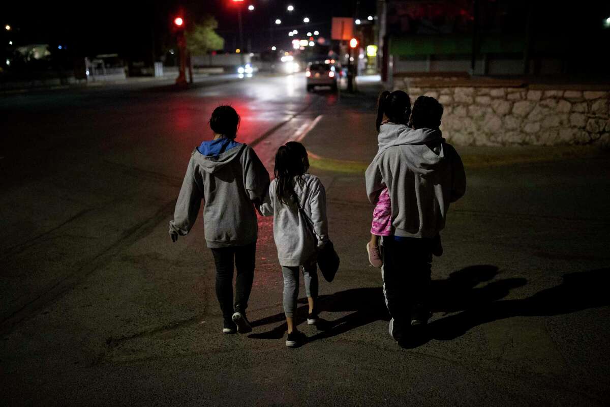 A husband and wife and their two daughters from Honduras walk through downtown Juarez moments after being deported from El Paso under Title 43 back into Mexico, Thursday, March 25, 2021, in Juarez, Mexico. Photo by Ivan Pierre Aguirre