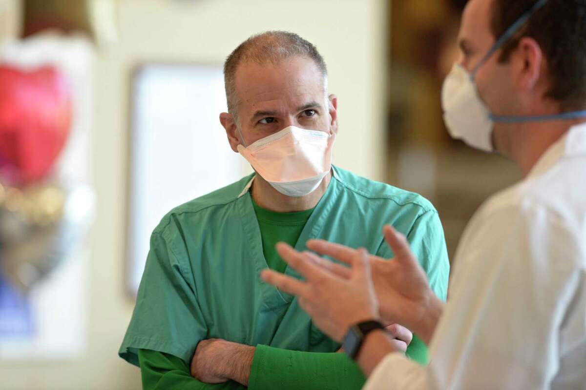 Dr John Chronakos MD, left, talks with Dr. Guillermo Ballarino MD, Pulmonary/Critical Care. Both are members of the medical team that worked with Chris Tillett, the first Covid-19 patient in Connecticut. Tuesday, April 5, 2020, at Danbury Hospital, Danbury Conn.