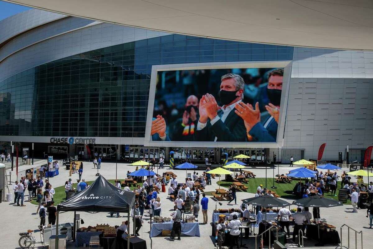 Video clips of Golden State Warriors president Rick Welts projected on the screen at Chase Center for Welts’ retirement party, Thursday, June 24, 2021, in San Francisco, Calif.