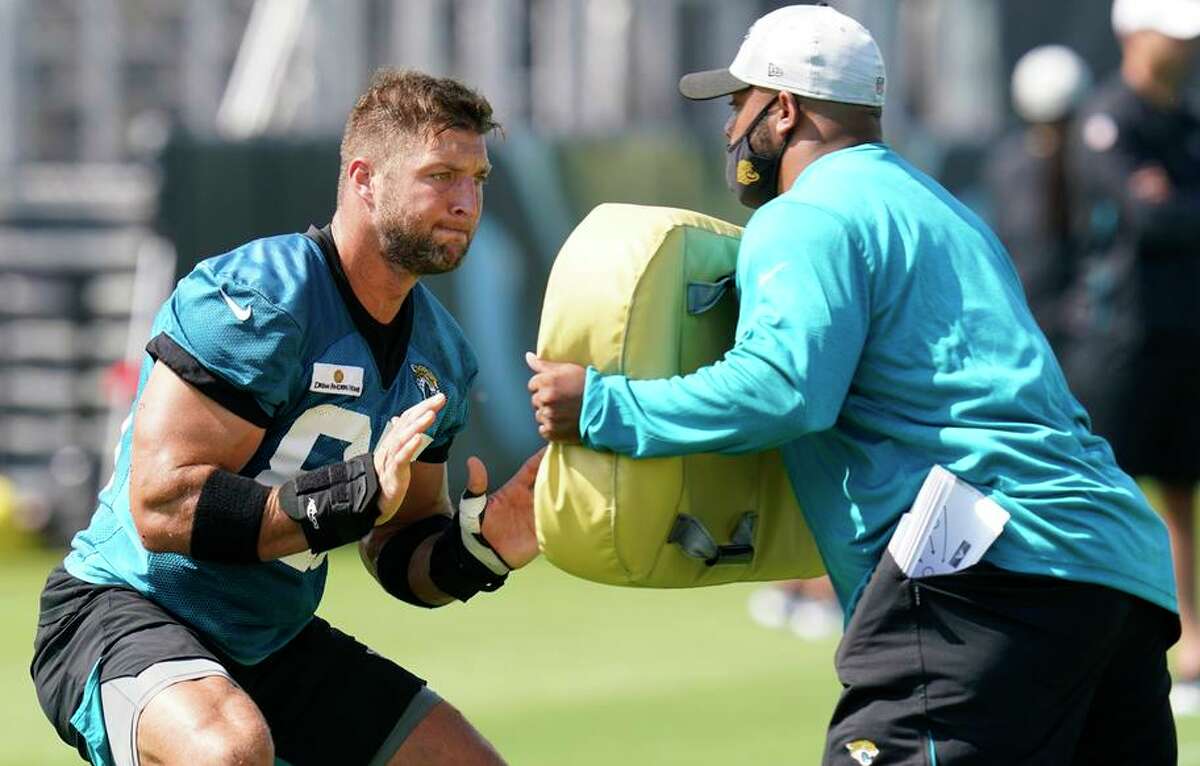 Tim Tebow (left) is getting a look with the Jacksonville Jaguars as a tight end, a position he has no experience in.