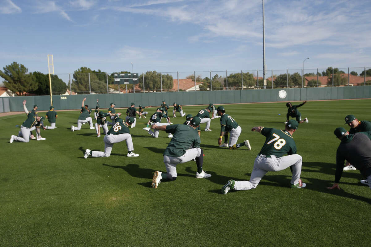 The Oakland Athletics stretch during a workout at Fitch Park on Feb. 19, 2020 in Mesa, Arizona.