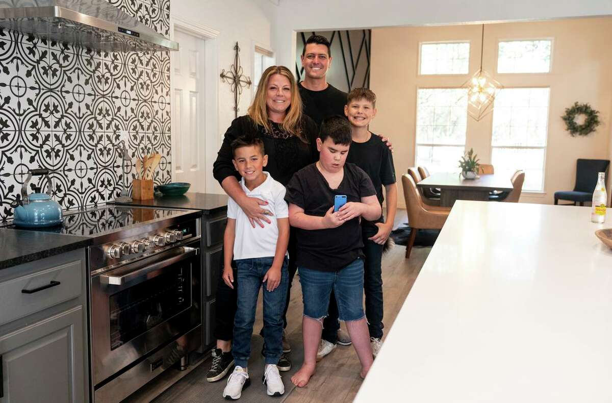 The de Grasse family is at home in Austin, Texas: Damien, 9; Jamie and Mark de Grasse; Declan de Grasse, 8; and Colin Paschke, 12.