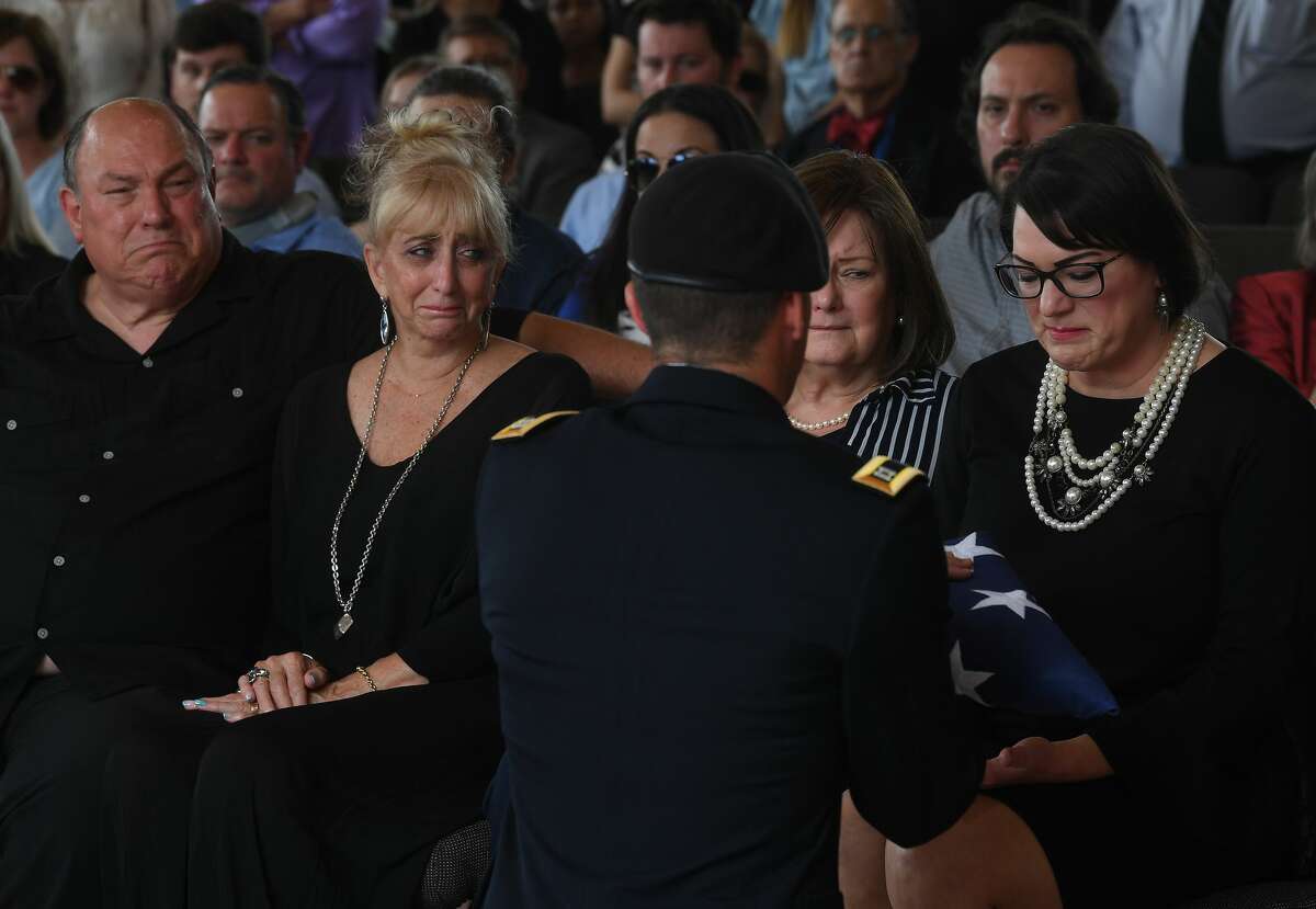 Jennifer Pate is presented with her father's flag during military honors at the funeral service for W.L. Pate at One City Church Friday. Photo made Friday, June 25, 2021 Kim Brent/The Enterprise