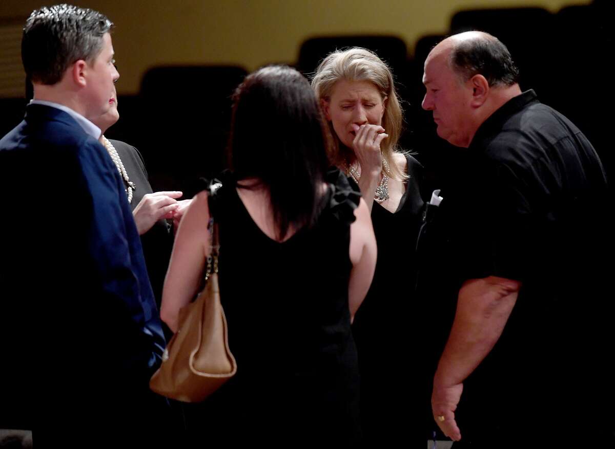 Sherrene Danks-Cook is emotional as she gathers with Pate family members during the funeral service for W.L. Pate at One City Church Friday. Photo made Friday, June 25, 2021 Kim Brent/The Enterprise