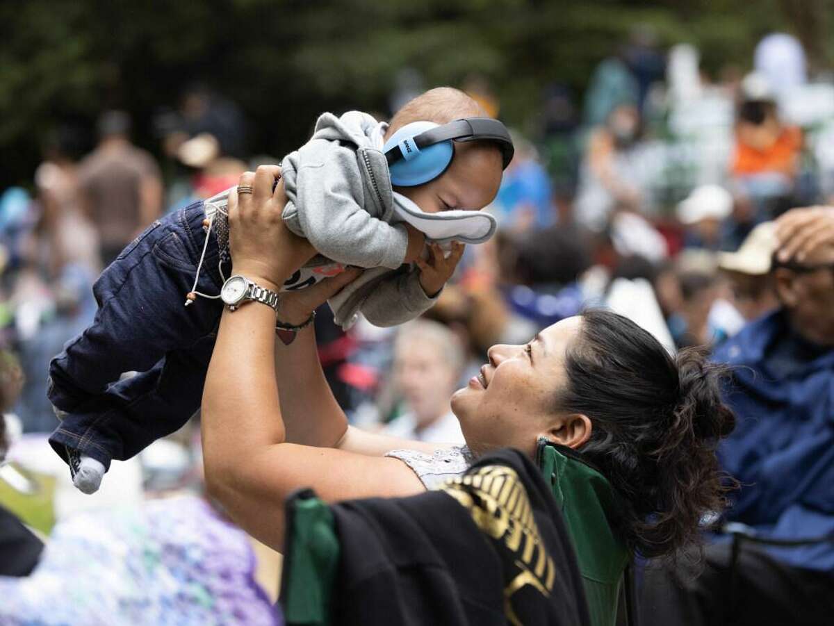 Mary Tiamzon-Lee holds Braxton Lee, 8-month, before the start of the Stern Grove Festival on Sunday, June 20, 2021 in San Francisco, Calif.