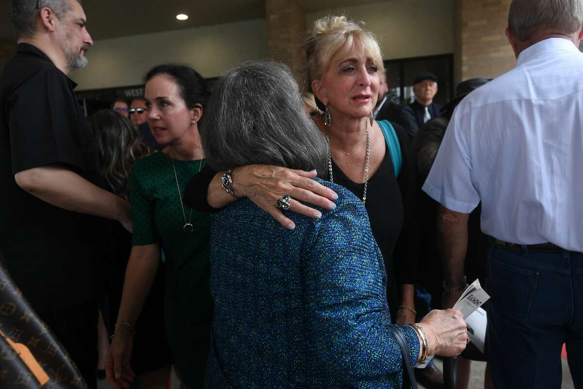 Sandy Pate is consoled on the loss of her brother-in-law during the funeral service for W.L. Pate at One City Church Friday. Photo made Friday, June 25, 2021 Kim Brent/The Enterprise