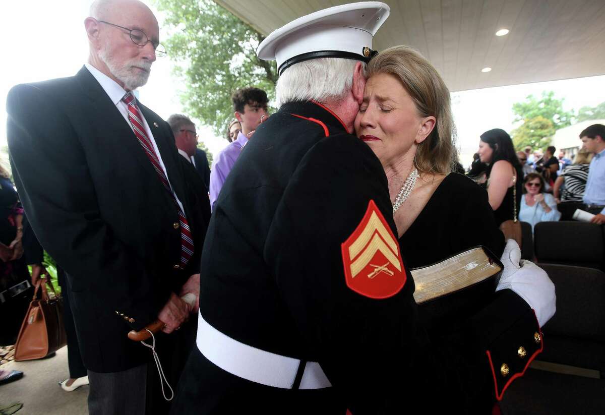 Fiance Sherrene Danks-Cook is comforted following the funeral service for W.L. Pate at One City Church Friday. Photo made Friday, June 25, 2021 Kim Brent/The Enterprise