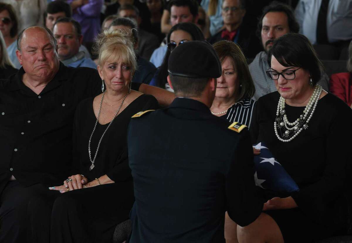 Jennifer Pate is presented with her father's flag during military honors at the funeral service for W.L. Pate at One City Church Friday. Photo made Friday, June 25, 2021 Kim Brent/The Enterprise