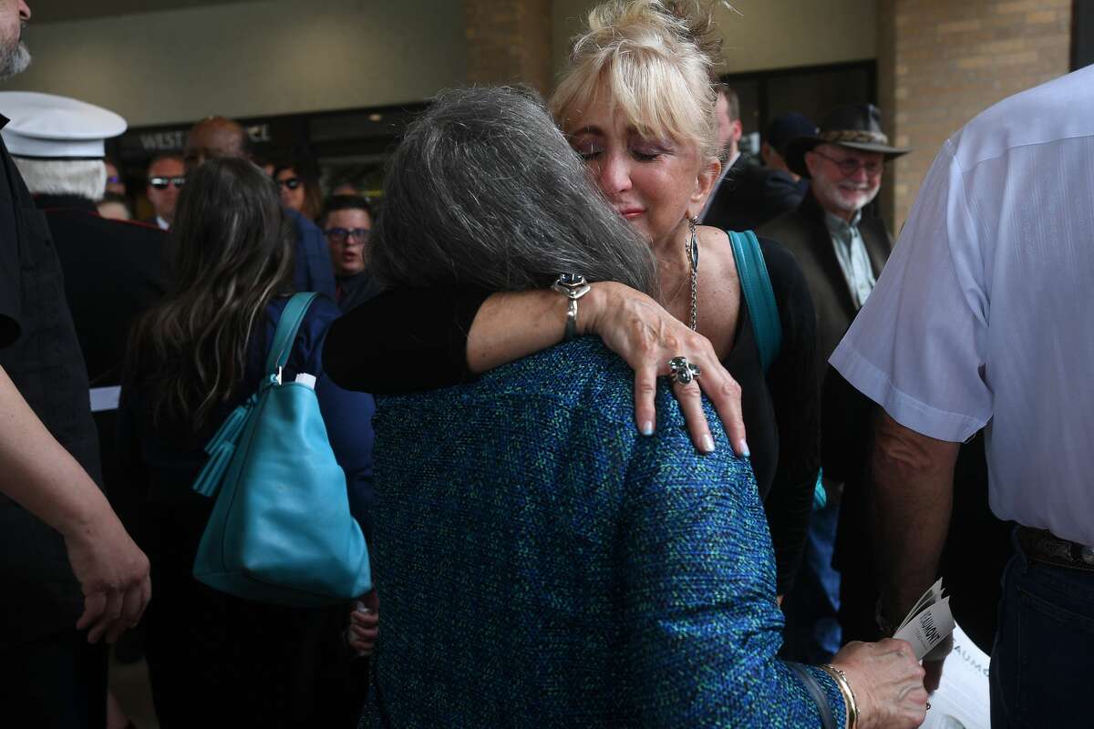 Sandy Pate hugs one of the attendees during the funeral service for W.L. Pate at One City Church Friday. Photo made Friday, June 25, 2021 Kim Brent/The Enterprise
