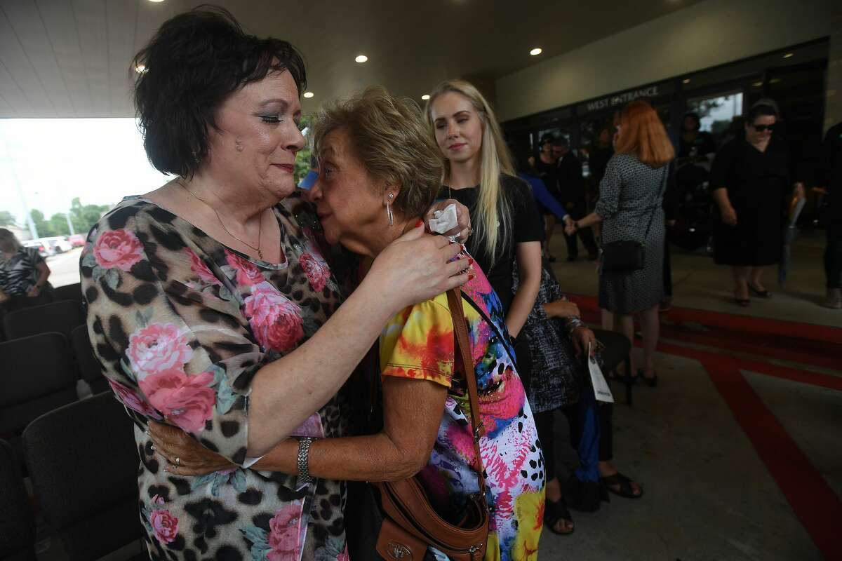 Pam Pate hugs a family member during the funeral service for her brother W.L. Pate at One City Church Friday. Photo made Friday, June 25, 2021 Kim Brent/The Enterprise