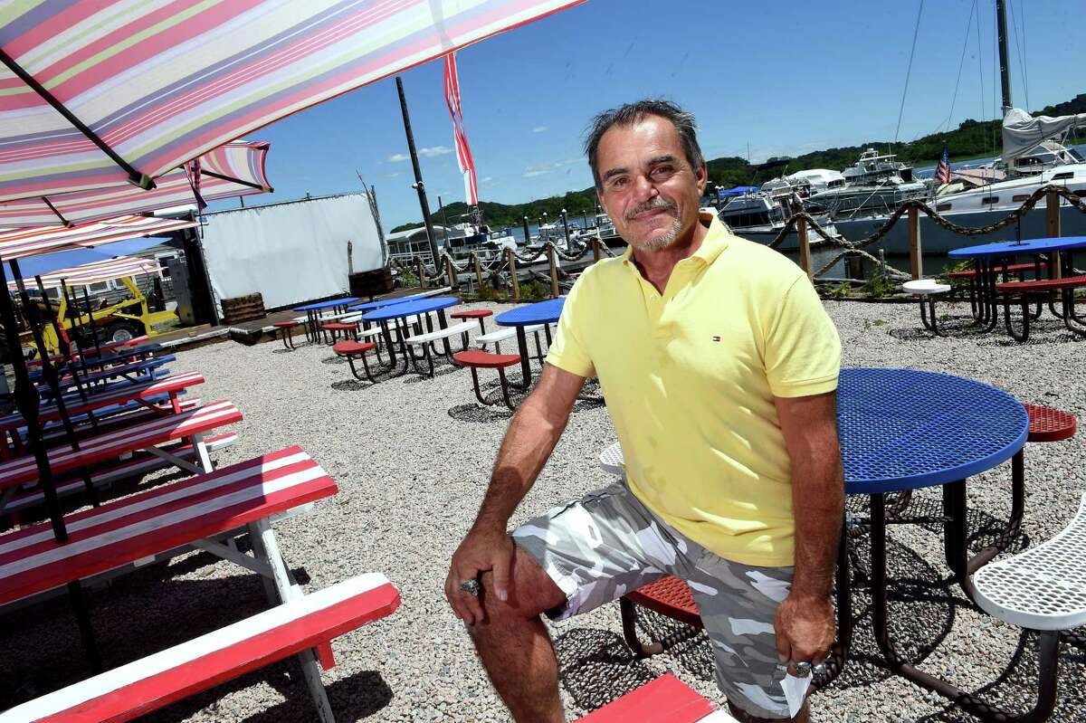 Steve Streeter, owner of Streets Boathouse Smokehouse, is photographed in the patio area of the restaurant at 307 Front Street in New Haven on June 24, 2021. In the background is a stage for live performances and a screen for showing movies.